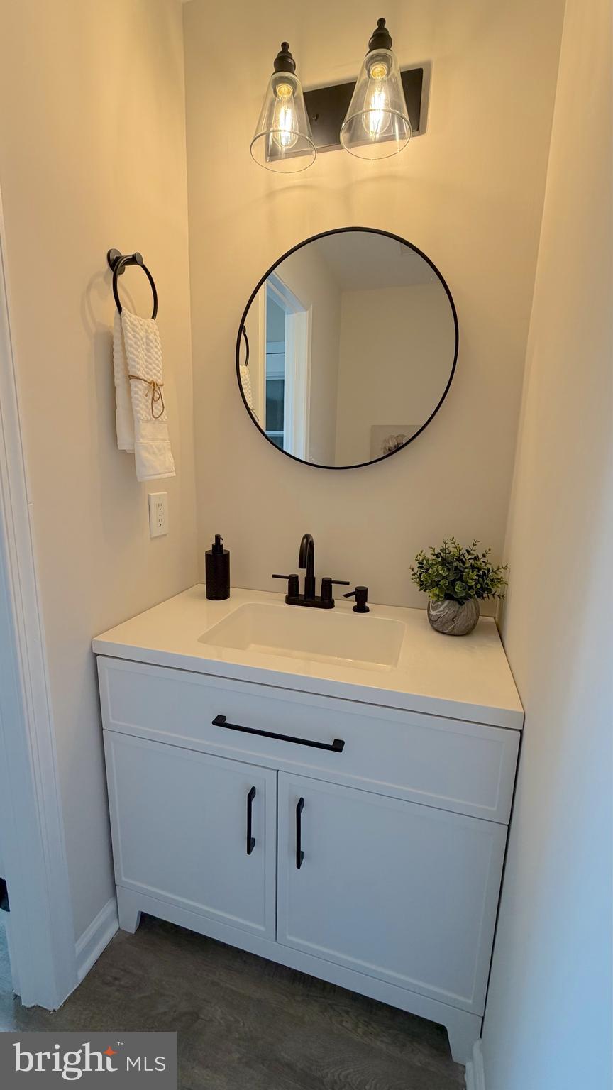 63 Raphael Road Smyrna, DE 19977 - Photo 10 of 27 a bathroom with a sink and a mirror