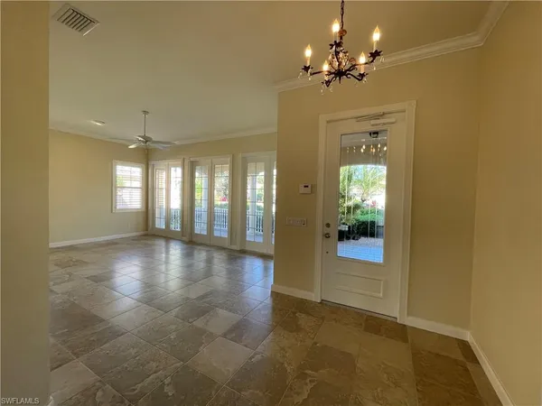 a view of an entryway with a chandelier