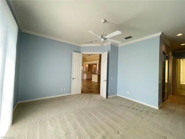 a view of an empty room with a window