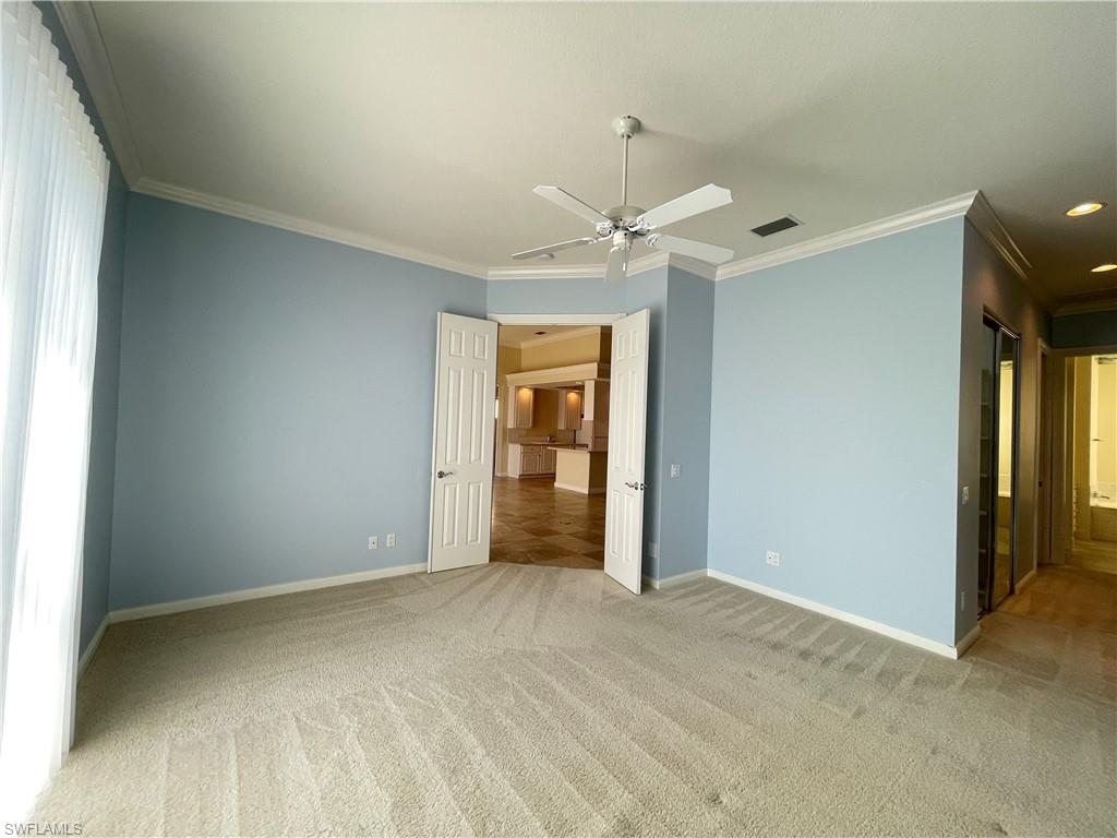 7025 Leopardi Court Naples, FL 34114 - Photo 16 of 48 a view of an empty room with a window