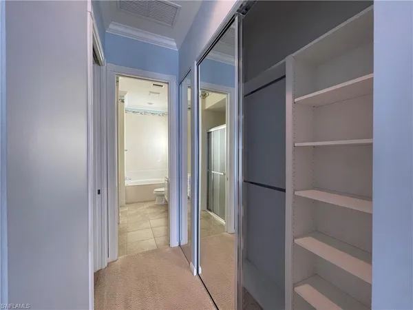 a view of an empty walk in closet