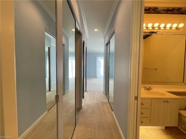 a view of a hallway with a door and a door