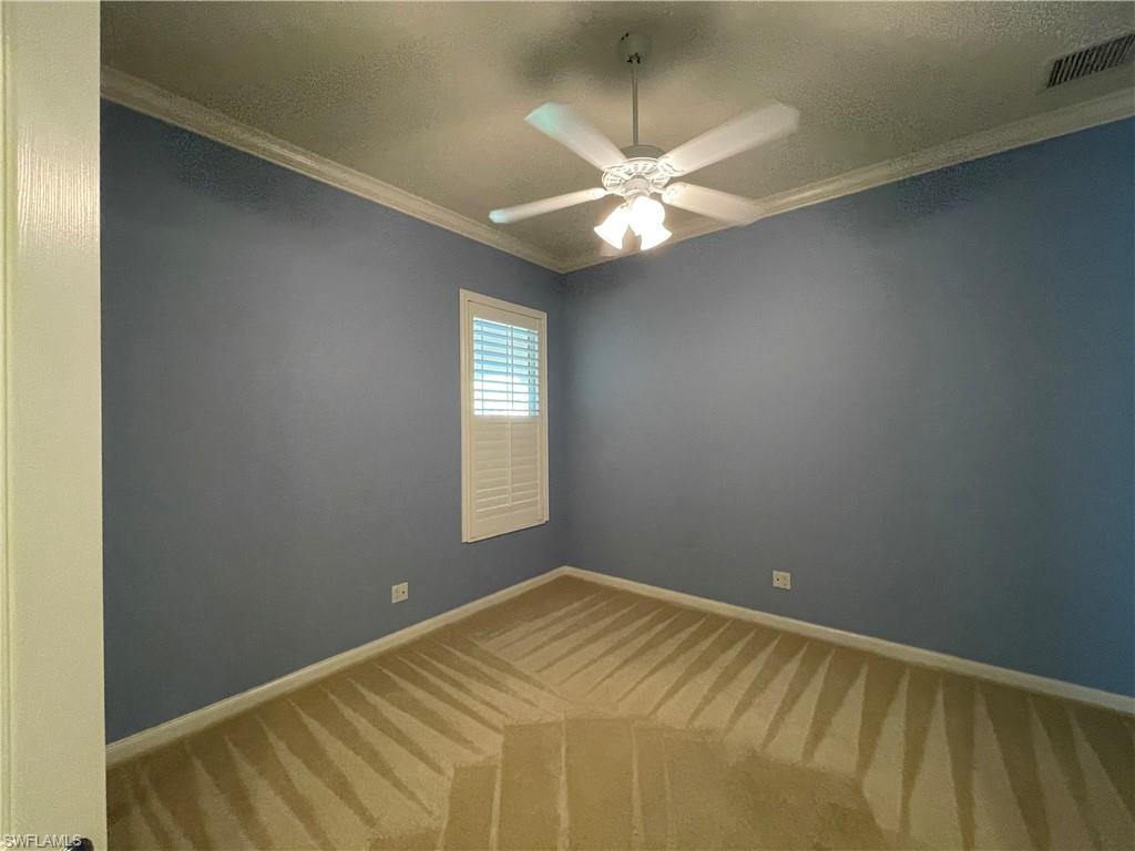 7025 Leopardi Court Naples, FL 34114 - Photo 23 of 48 a view of an empty room with a window