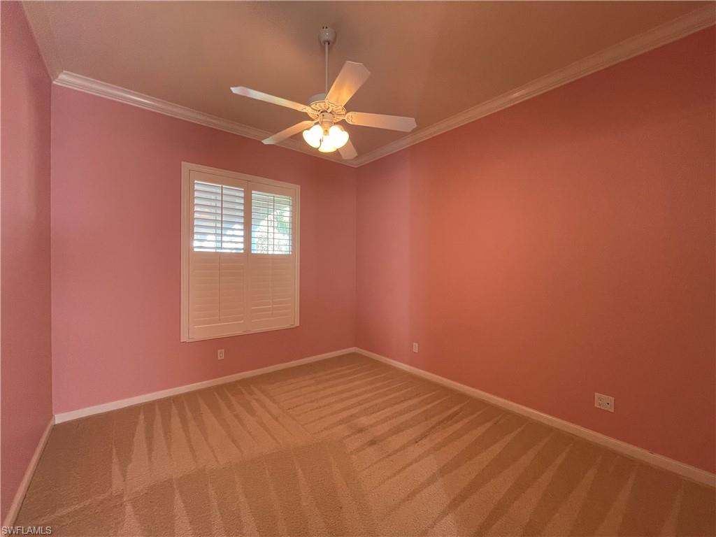 7025 Leopardi Court Naples, FL 34114 - Photo 25 of 48 an empty room with a window and a fan