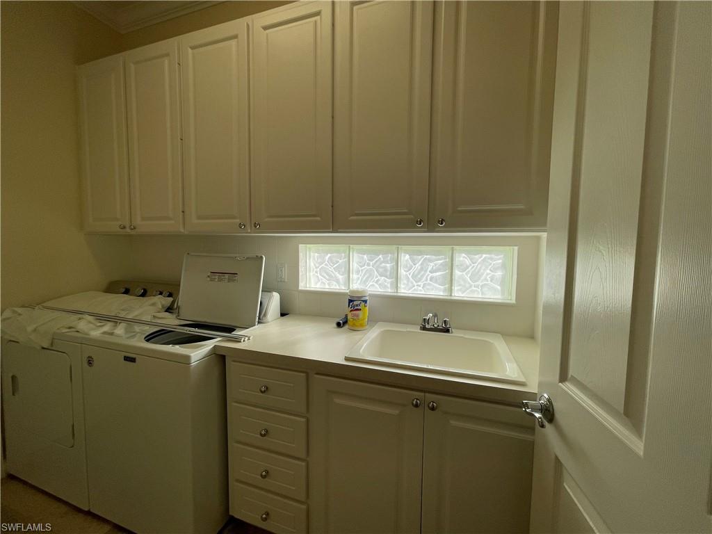 7025 Leopardi Court Naples, FL 34114 - Photo 30 of 48 a utility room with dryer and washer