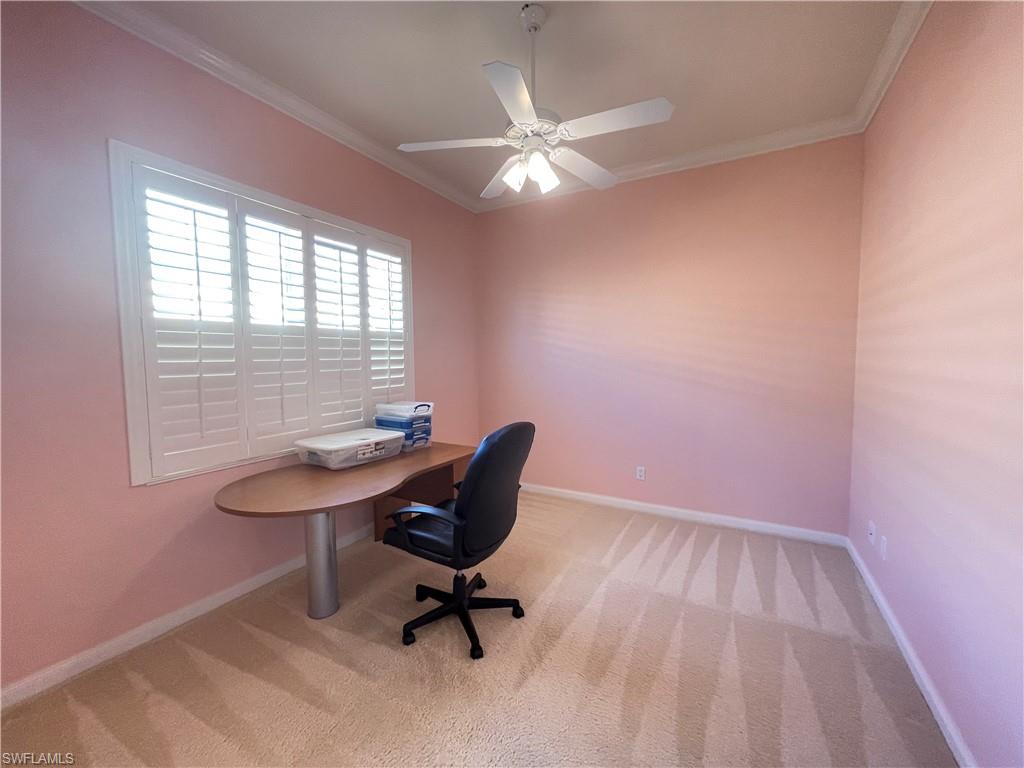 7025 Leopardi Court Naples, FL 34114 - Photo 31 of 48 a view of a workspace with furniture and a window