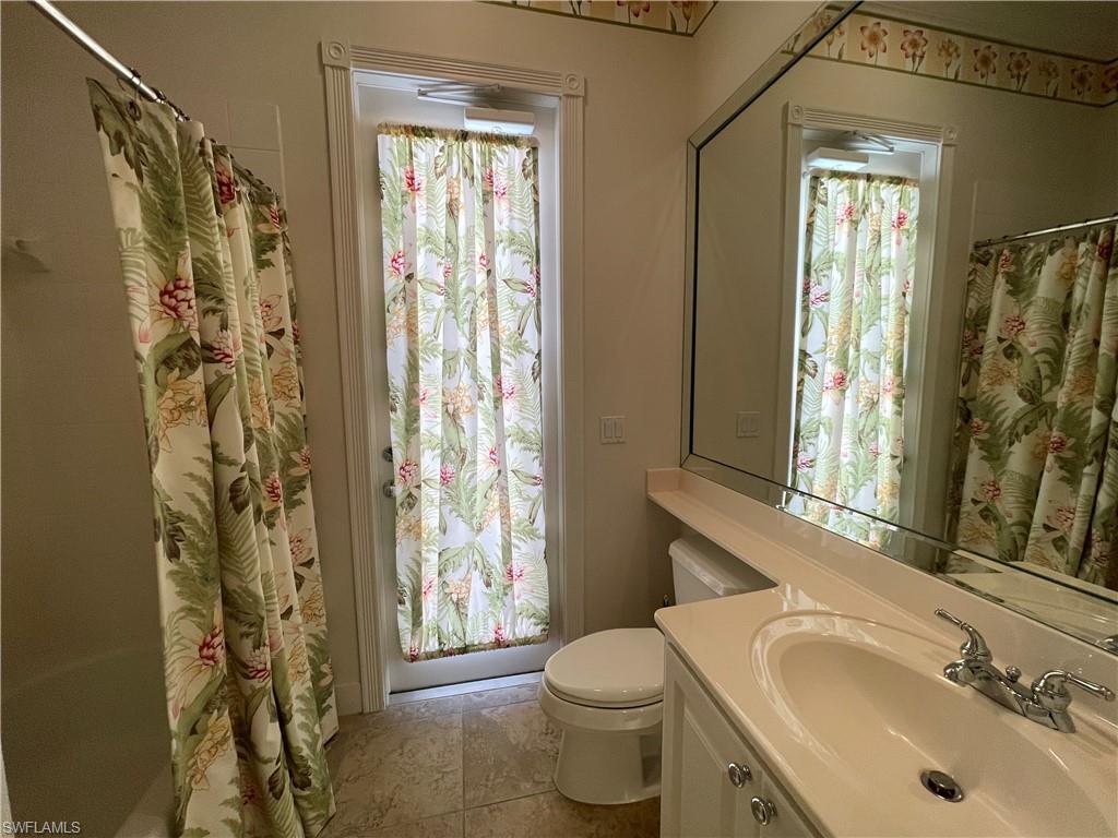 7025 Leopardi Court Naples, FL 34114 - Photo 32 of 48 a bathroom with a sink toilet and shower