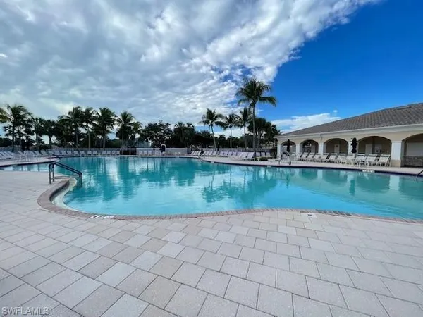 a view of a swimming pool with a patio