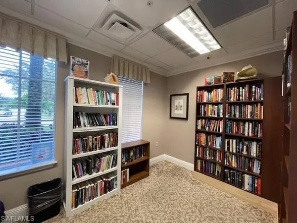 a room with gym equipment and a large window