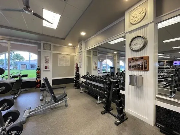 a room with gym equipment and a large window