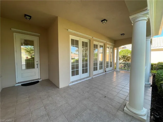 a view of an entryway with wooden floor and windows