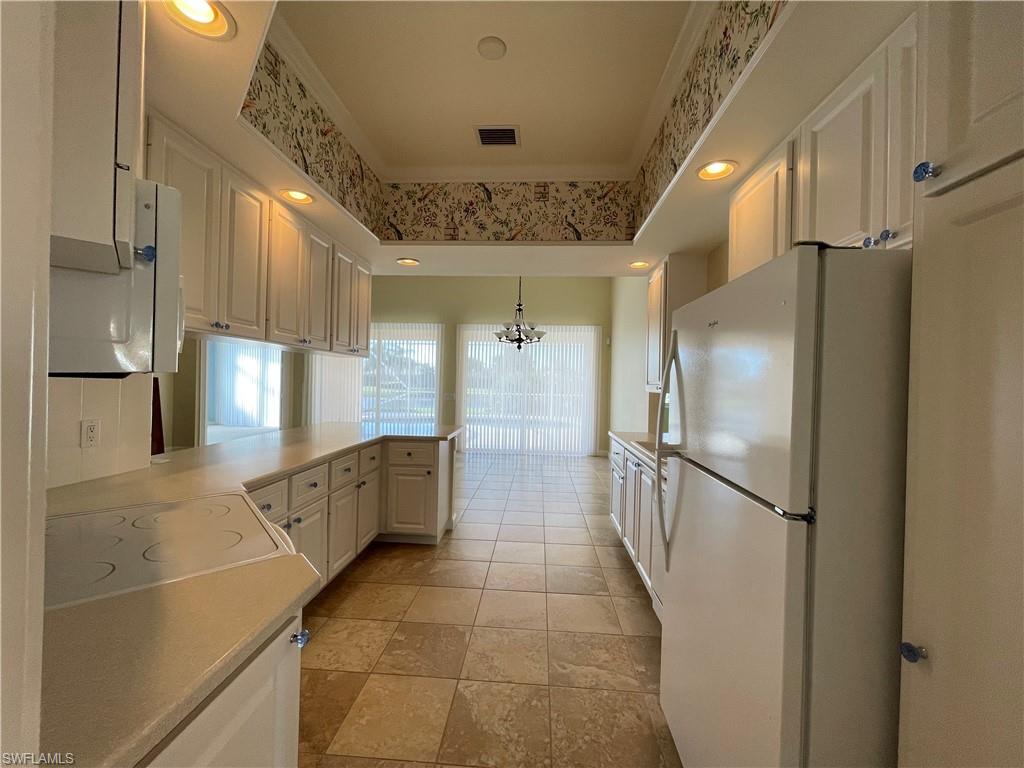 7025 Leopardi Court Naples, FL 34114 - Photo 9 of 48 a bathroom with a mirror and a shower