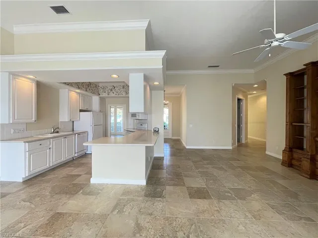 a large bathroom with a large tub shower and sink