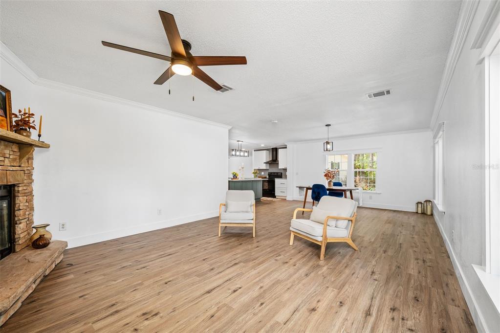 13076 Southwest 154th Street Archer, FL 32618 - Photo 23 of 60 a living room with furniture and a wooden floor