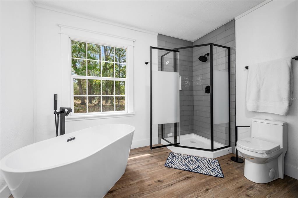 13076 Southwest 154th Street Archer, FL 32618 - Photo 31 of 60 a bathroom with a toilet and a shower