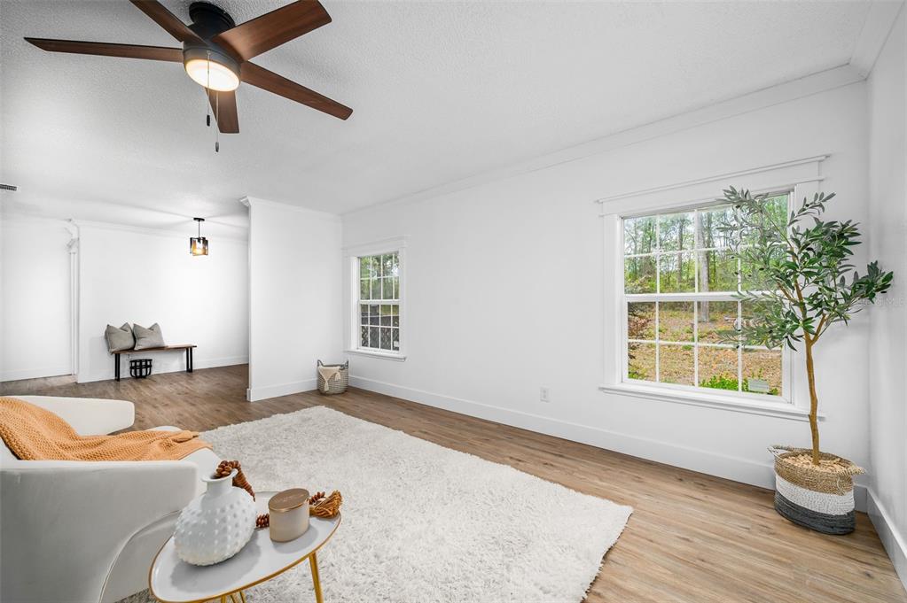 13076 Southwest 154th Street Archer, FL 32618 - Photo 7 of 60 a living room with furniture and a large window