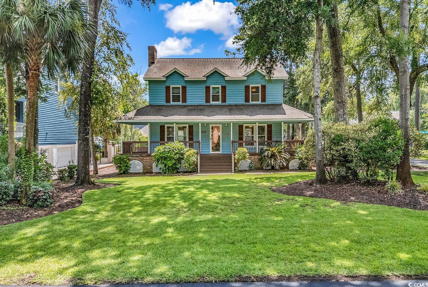 317 14th Avenue North Surfside Beach, SC 29575 - Photo 1 of 40 View of front of house featuring a porch, a chimne