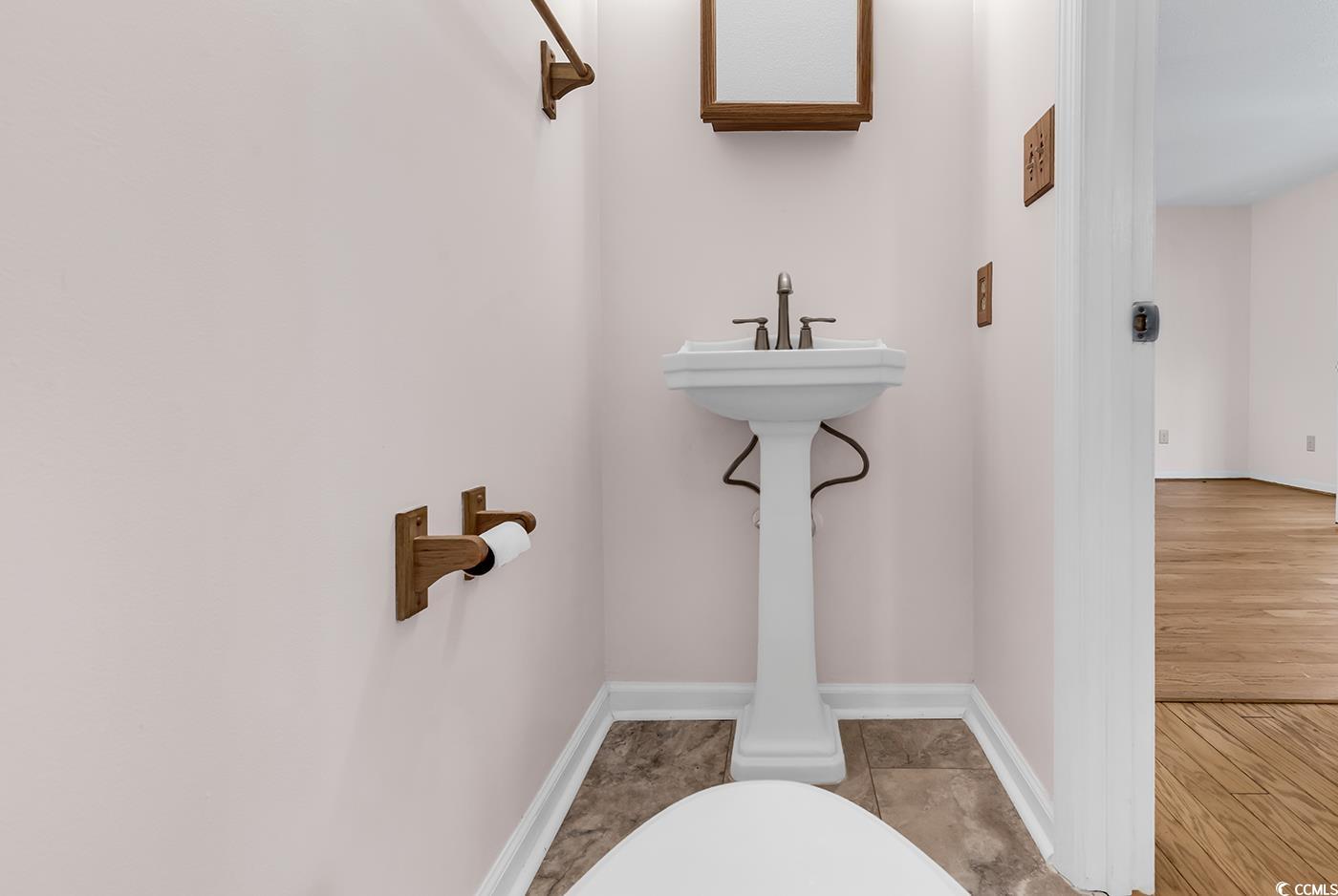 317 14th Avenue North Surfside Beach, SC 29575 - Photo 14 of 40 Half bathroom with baseboards