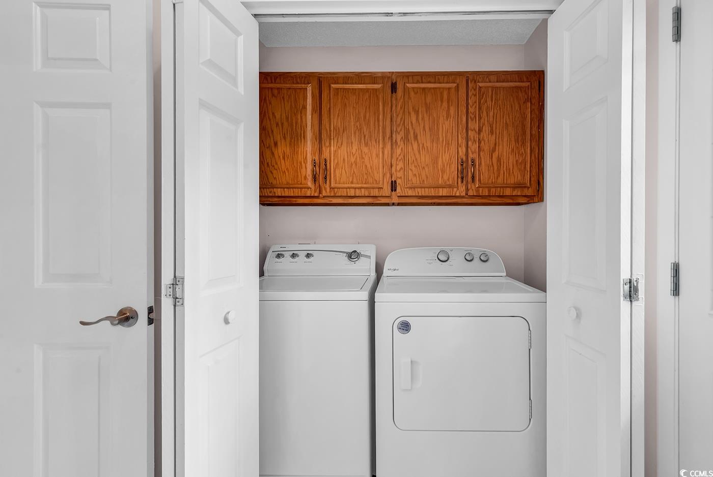 317 14th Avenue North Surfside Beach, SC 29575 - Photo 15 of 40 Laundry room with cabinet space and independent wa