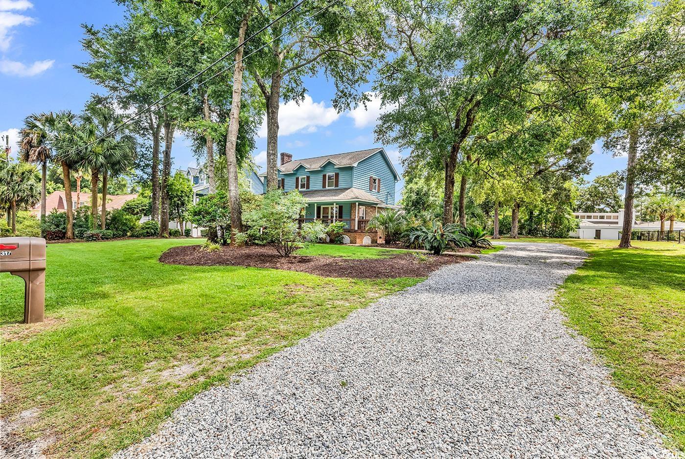 317 14th Avenue North Surfside Beach, SC 29575 - Photo 35 of 40 View of front of property featuring a front yard a
