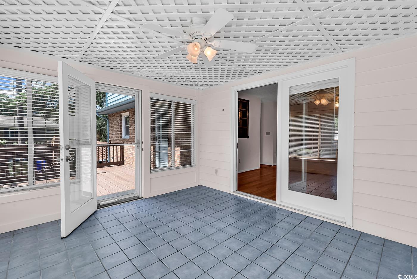 317 14th Avenue North Surfside Beach, SC 29575 - Photo 8 of 40 Unfurnished sunroom featuring a ceiling fan