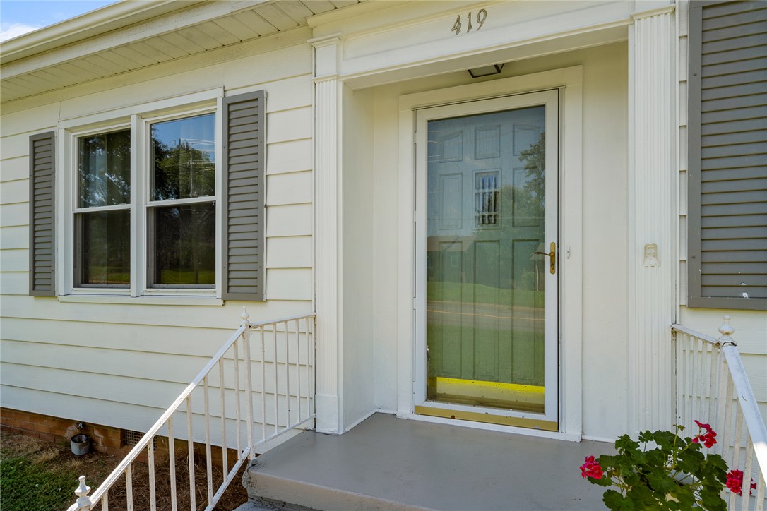 419 Whitehall Road Anderson, SC 29625 - Photo 2 of 28 A welcoming entry with traditional white siding and charming gray shutters.