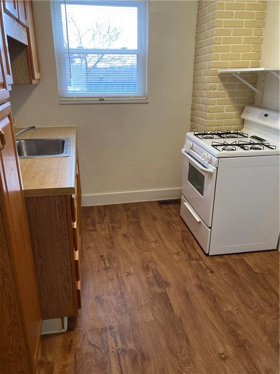 3200-3202 Willett Road Pittsburgh, PA 15227 - Photo 25 of 46 a kitchen with granite countertop a stove and a microwave
