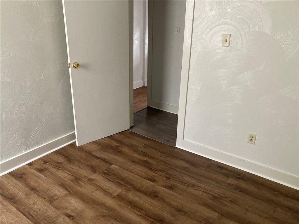 3200-3202 Willett Road Pittsburgh, PA 15227 - Photo 30 of 46 an empty room with wooden floor and windows