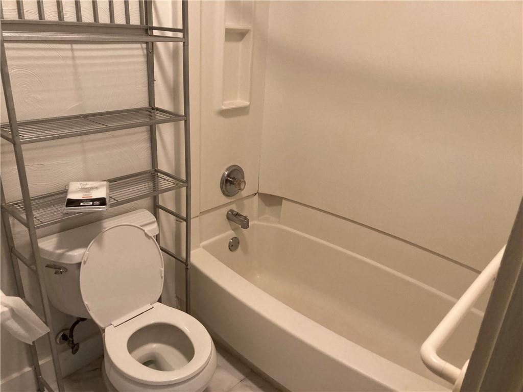 3200-3202 Willett Road Pittsburgh, PA 15227 - Photo 31 of 46 a white toilet sitting next to a bath tub