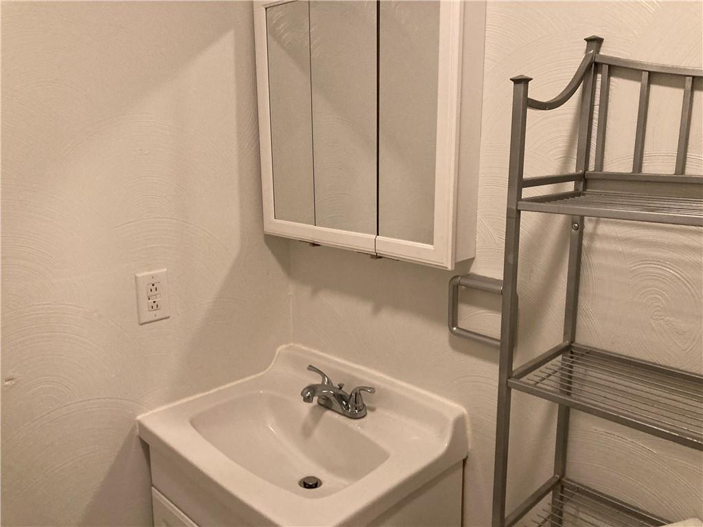 3200-3202 Willett Road Pittsburgh, PA 15227 - Photo 32 of 46 a bathroom with a sink and a mirror