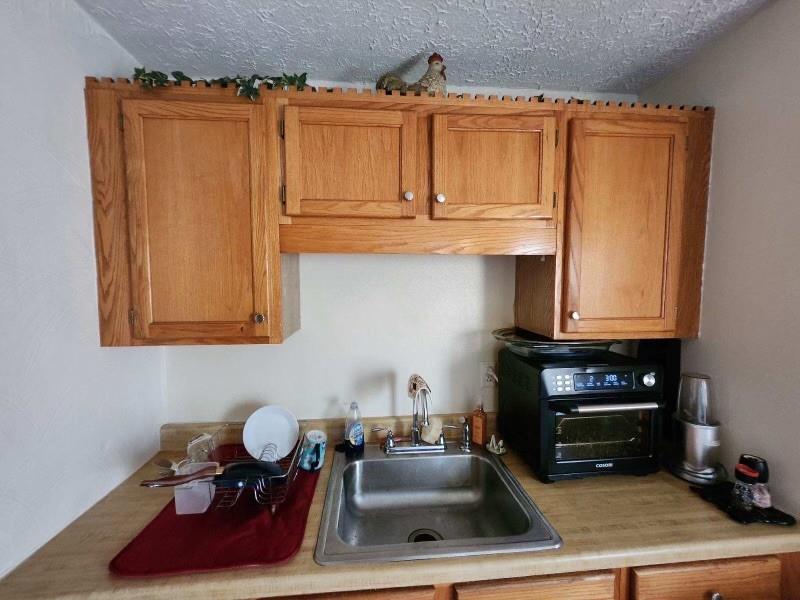 3200-3202 Willett Road Pittsburgh, PA 15227 - Photo 41 of 46 a kitchen with a sink and cabinets
