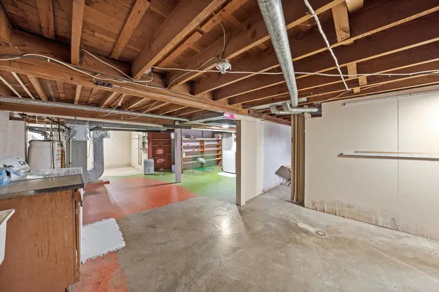 a view of a room with wooden floors