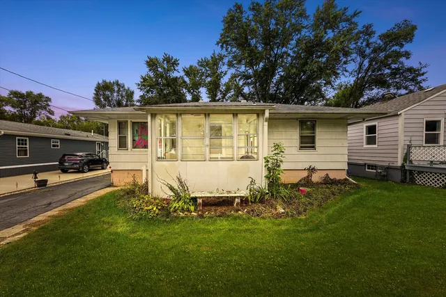 a view of a backyard with a car parked in it