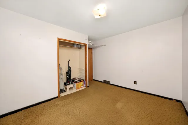 a view of room with wooden floor