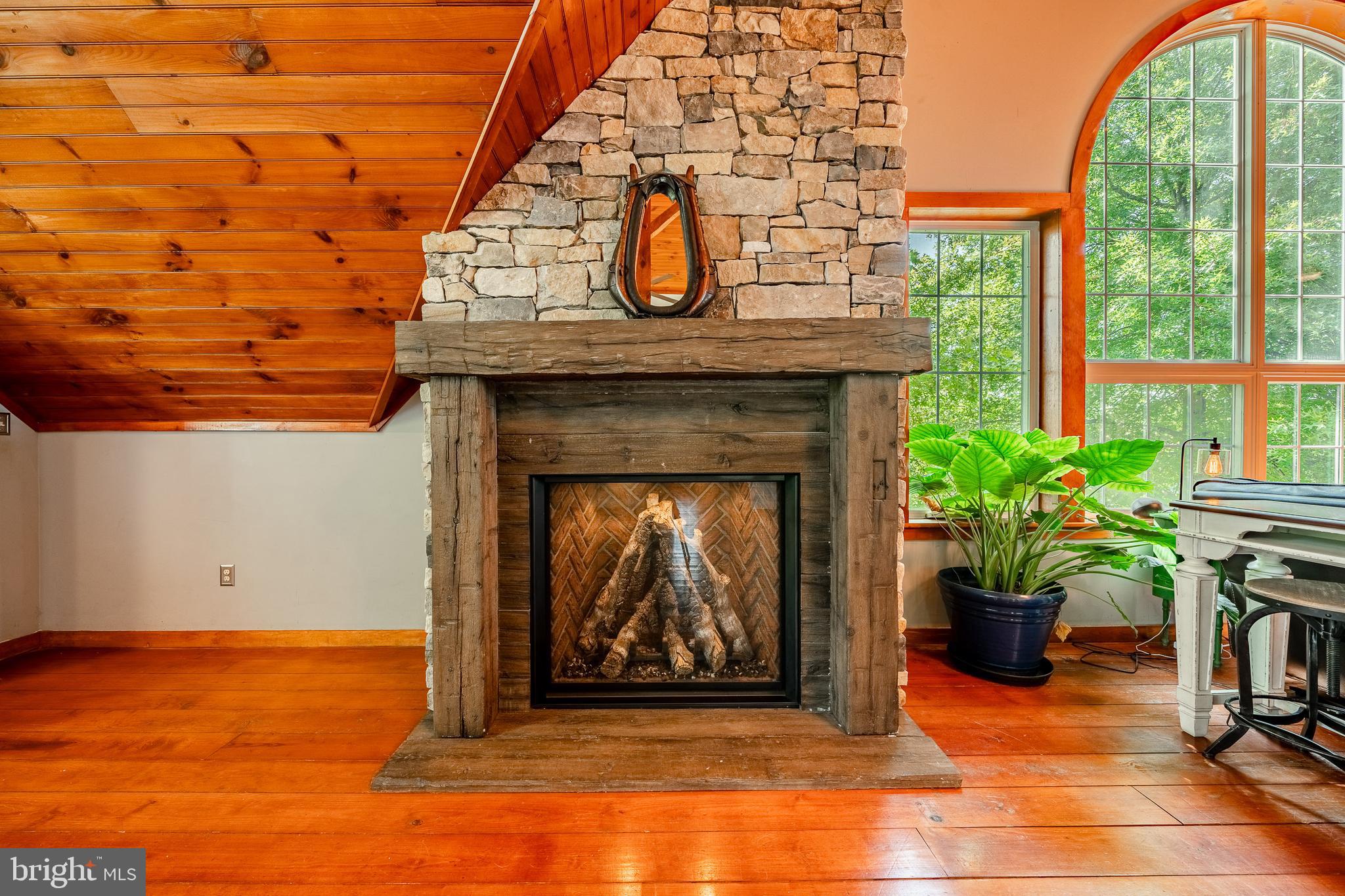 301 High Point Road Cochranville, PA 19330 - Photo 20 of 28 a living room with a fireplace