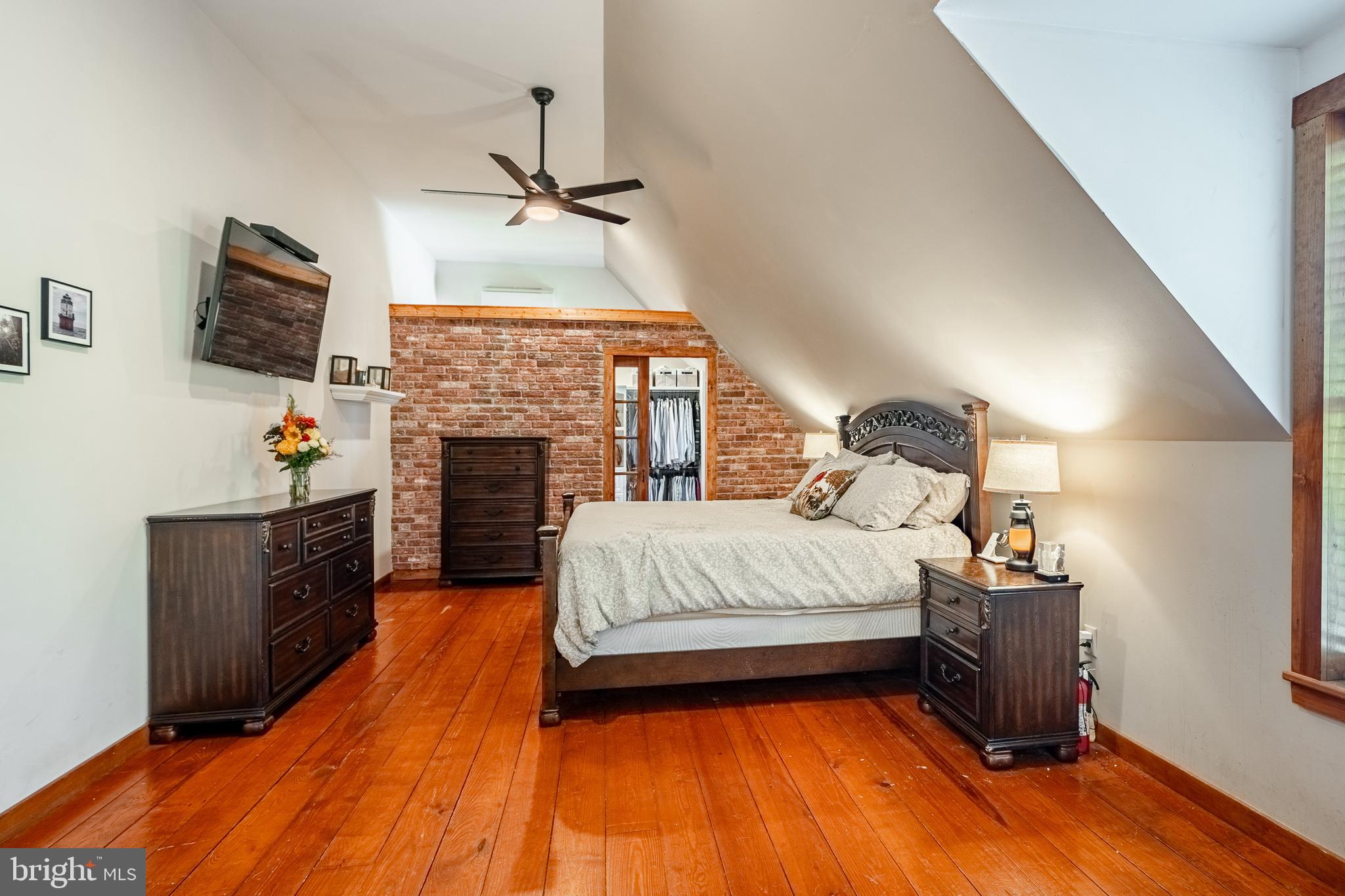 301 High Point Road Cochranville, PA 19330 - Photo 22 of 28 a spacious bedroom with a bed and a fireplace