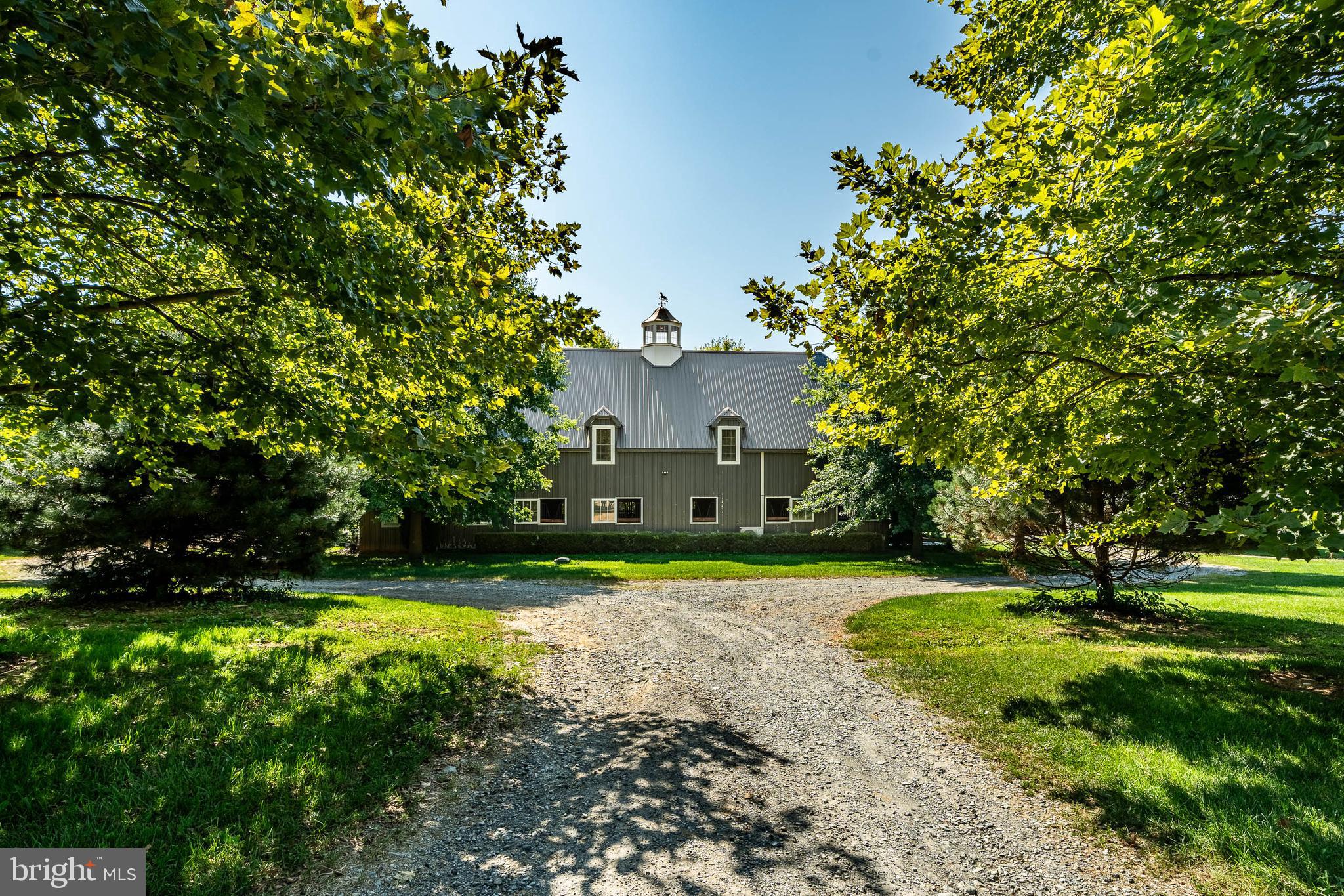 301 High Point Road Cochranville, PA 19330 - Photo 4 of 28 a view of a house with a yard and basketball court