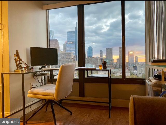 a view of a livingroom with furniture and a flat screen tv