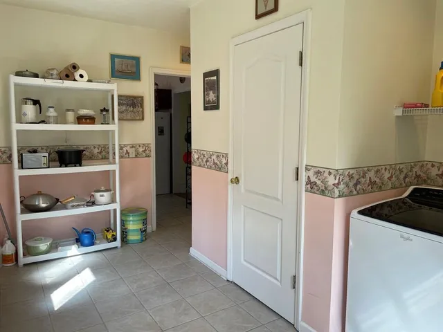 a kitchen with a refrigerator and a cabinets