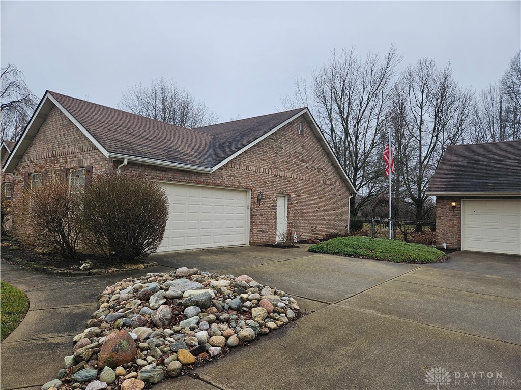 4909 Shannon Avenue Springfield, OH 45504 - Photo 2 of 21 This classic brick residence features an attached garage and a separate detached garage, offering ample parking.