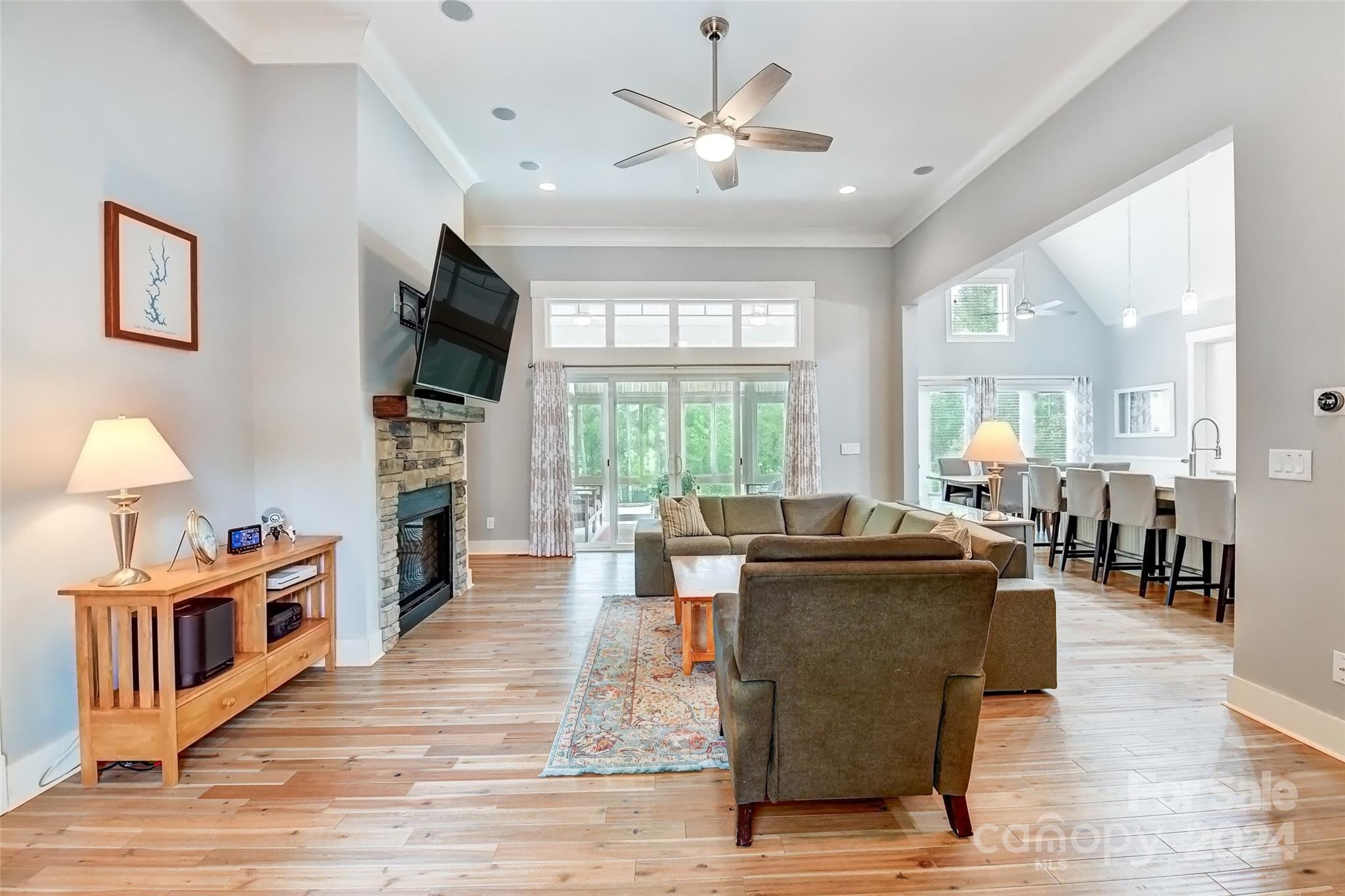 444 Evergreen Road Clover, SC 29710 - Photo 4 of 47 a living room with furniture a flat screen tv and a large window