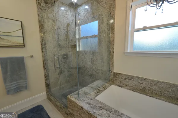 a view of a livingroom with furniture and windows