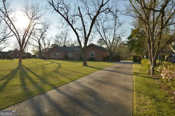 a view of a backyard with dishwasher and stove