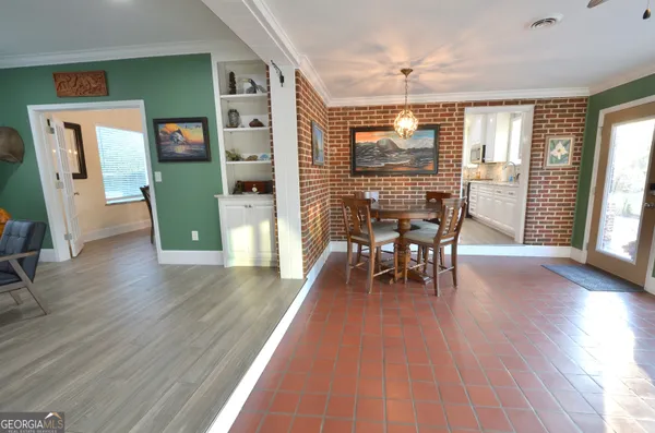 a backyard of a house with table and chairs