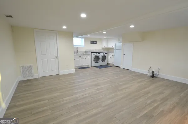 a view of a house with a yard and sitting area
