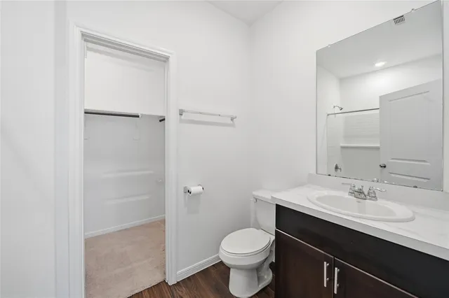 a bathroom with a sink toilet a vanity and shower