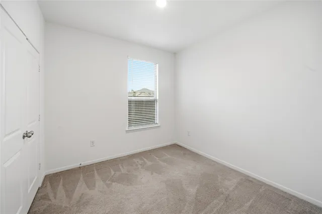 a view of a bathroom from a hallway