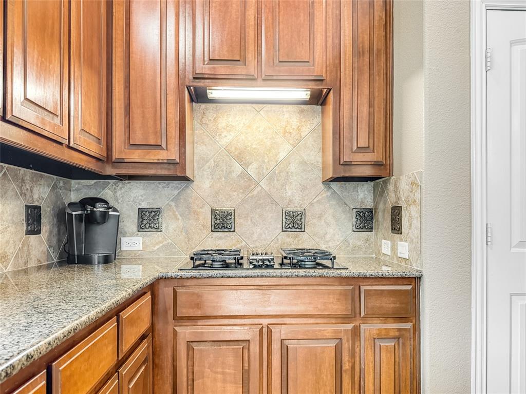 401 Varnum Way Fairview, TX 75069 - Photo 9 of 33 a kitchen with stainless steel appliances granite countertop a sink and cabinets