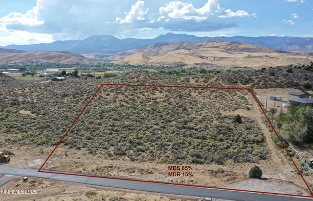 a view of a yard with a mountain