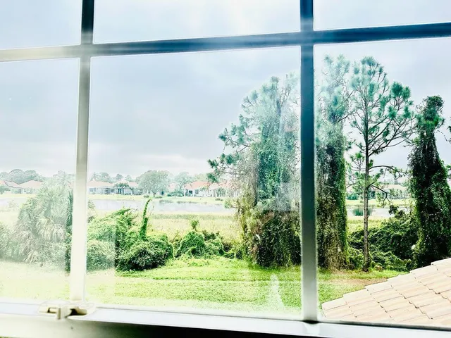 a view of a field with an ocean